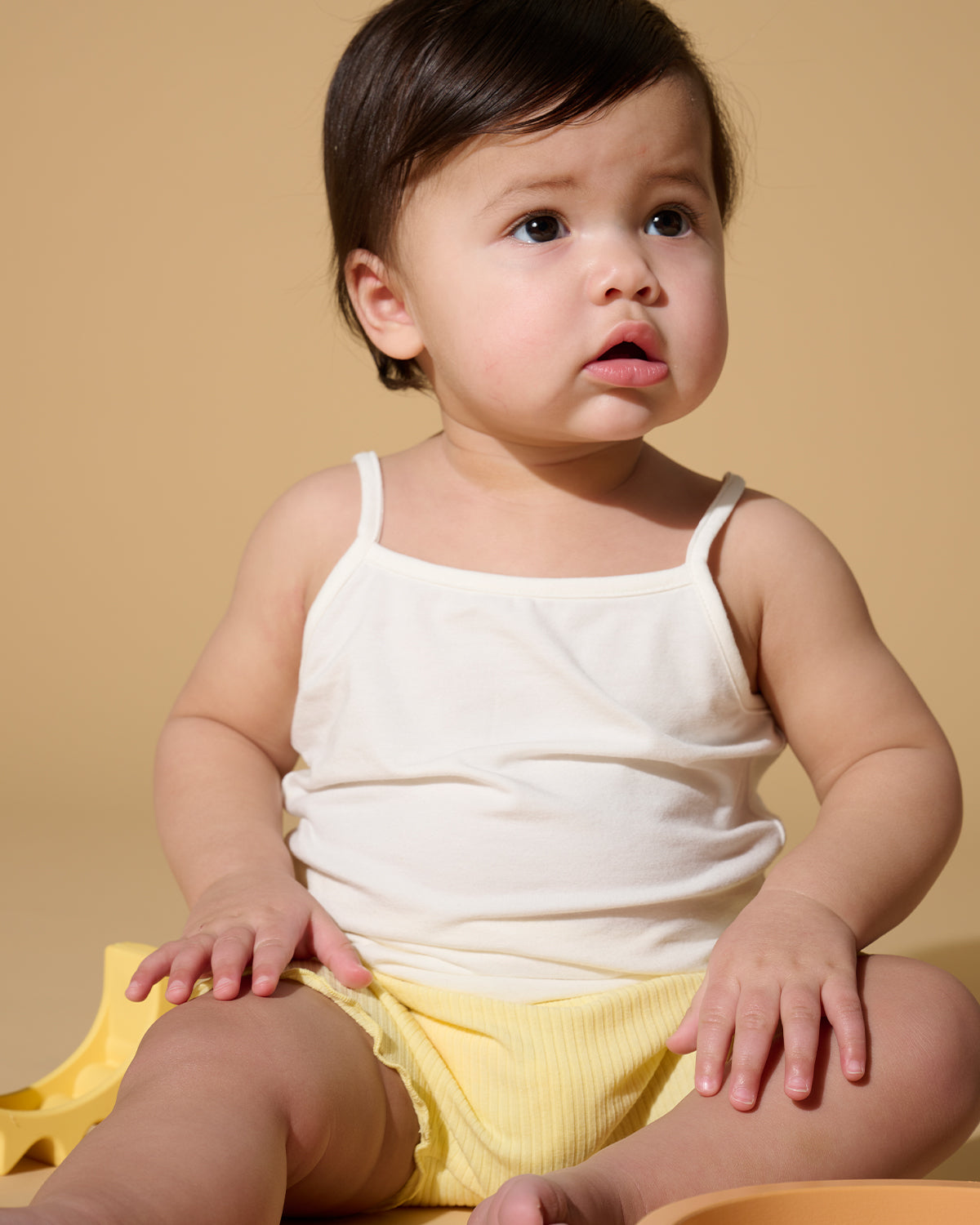 Soft bamboo and organic cotton cami tank top for babies and kids. Breathable, stay-put straps and comfy fit designed for all-day wear