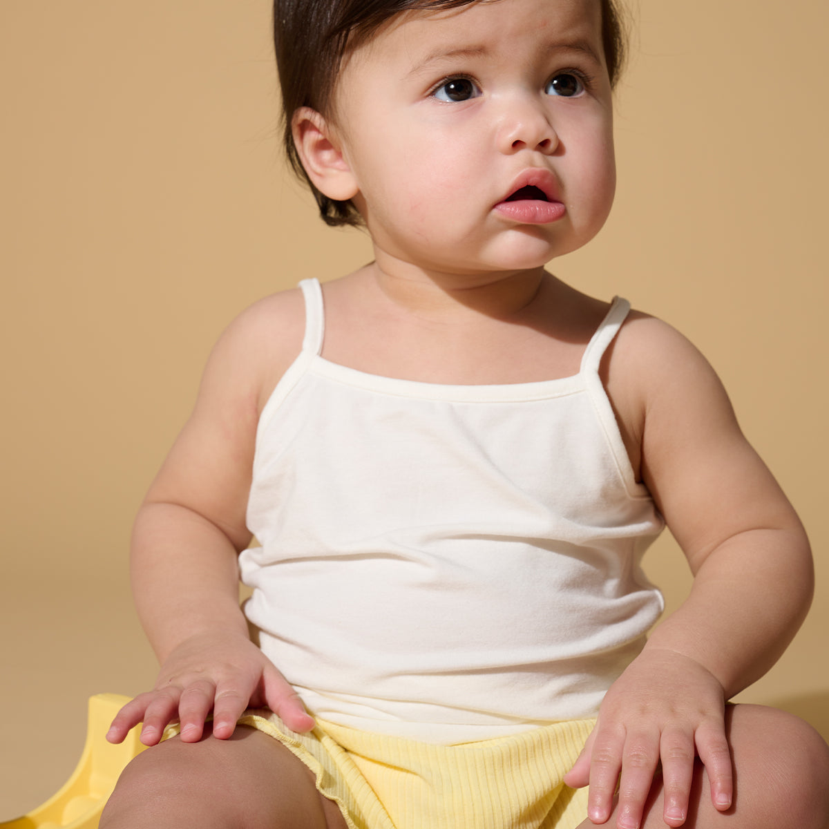 Soft bamboo and organic cotton cami tank top for babies and kids. Breathable, stay-put straps and comfy fit designed for all-day wear